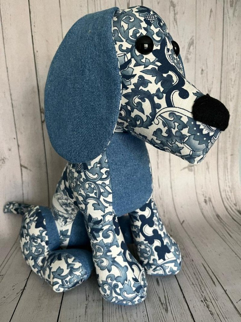 blue and white paisley print dog made from clothes. Black eyes and nose. 15x15 size.