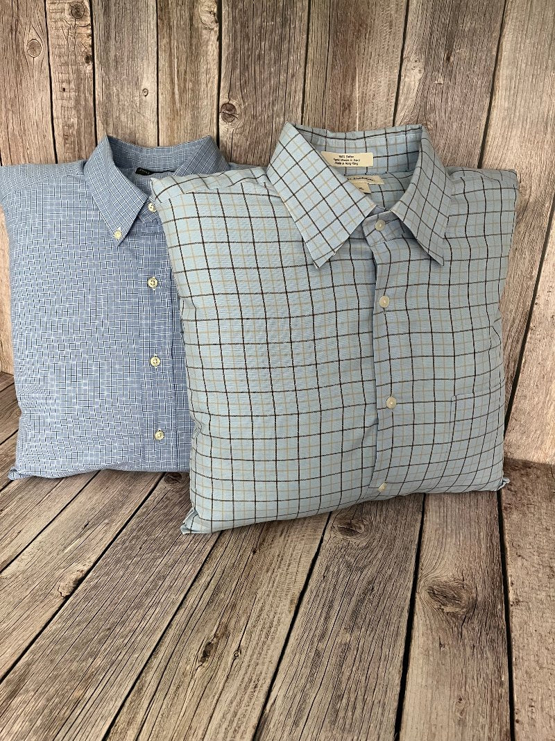 Two 16x16 keepsake pillows made from a customer's shirts. Both shirts are light blue with plaid designs.