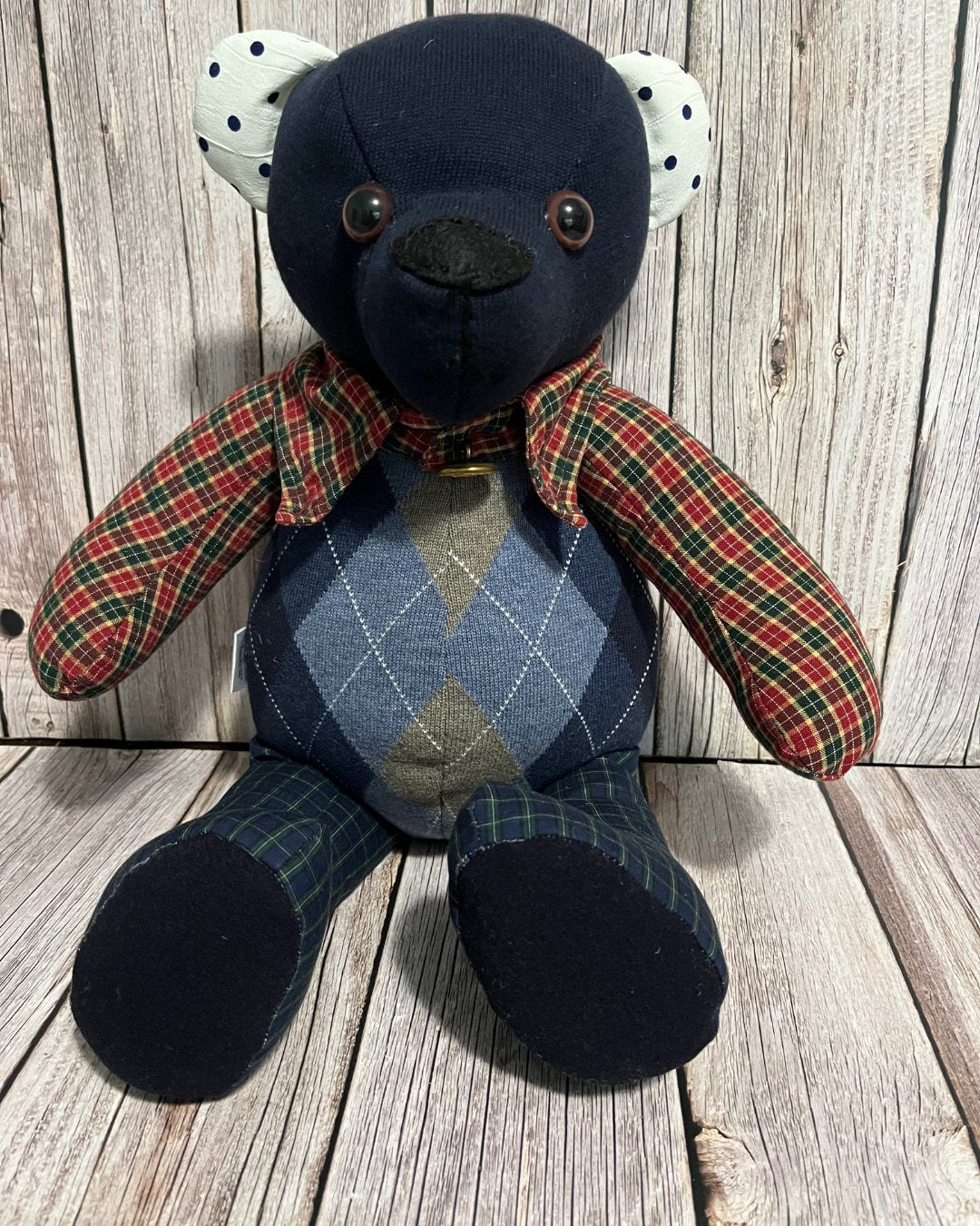 Teddy Bear made from clothes. Bear is blue and plaid with blue vest.